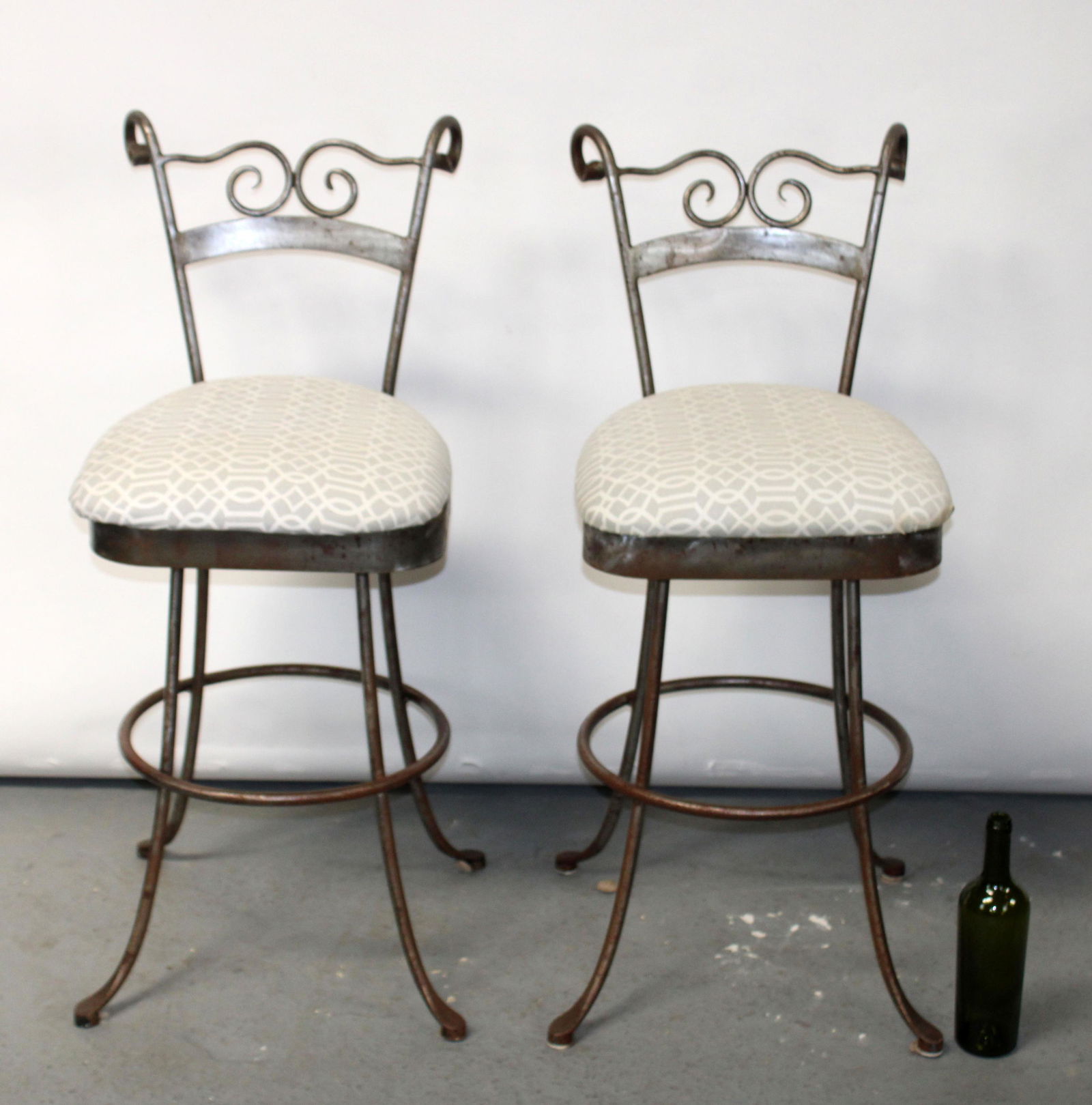 Pair of scrolled iron swivel counter stools (1 of 6)