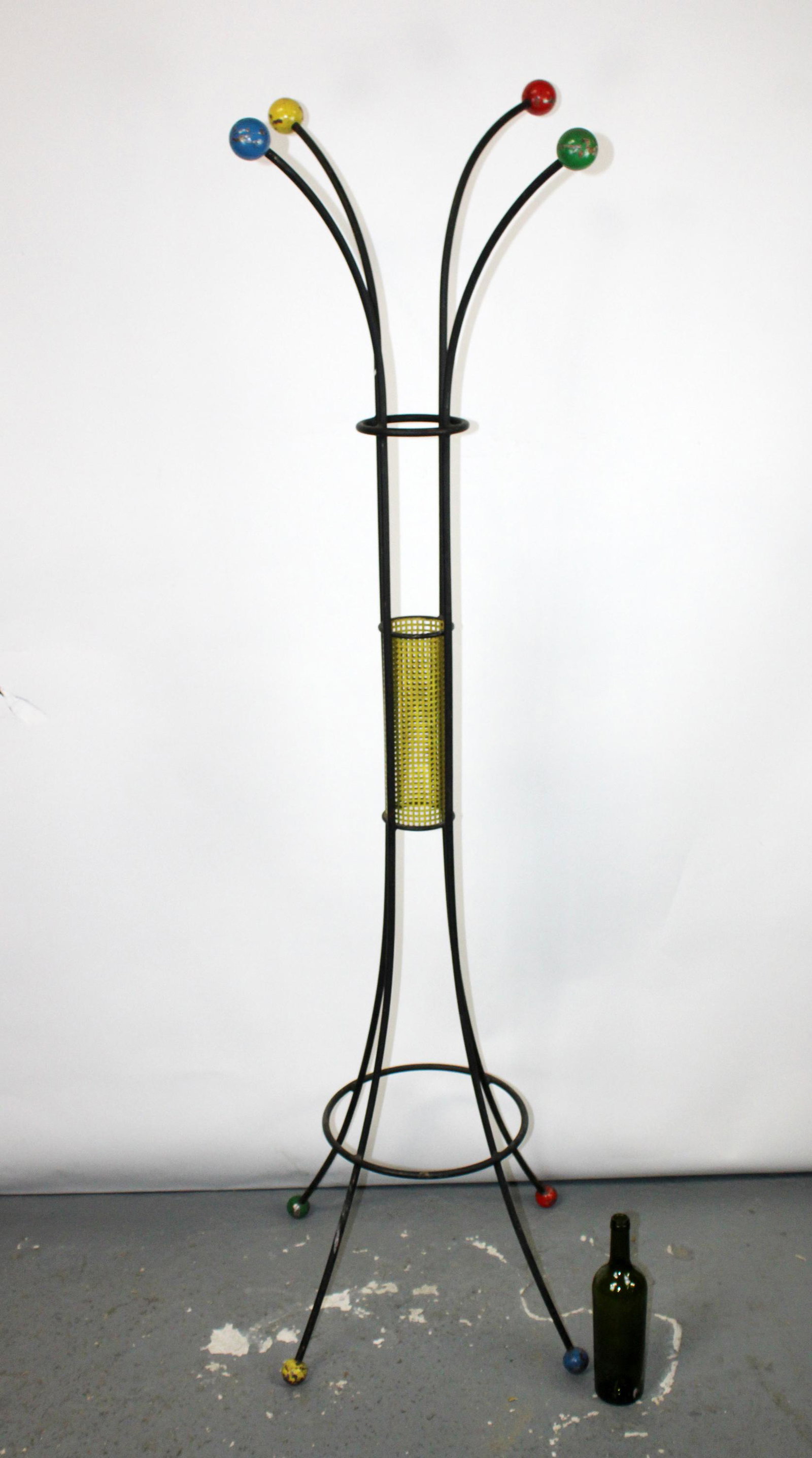 French mid century iron standing coat rack: French mid century iron standing coat rack with multi color balls in the manner of Roger Feraud. Circa 1960's. 72 1/2"h x 26"w