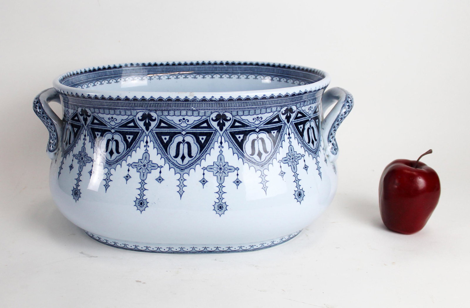 French Sarreguemines Calcutta oval jardiniere: French Sarreguemines Calcutta blue & white oval jardiniere. Early 20th century. 7 7/8"h x 16"l x 11"w (13" x 10 3/8" opening)