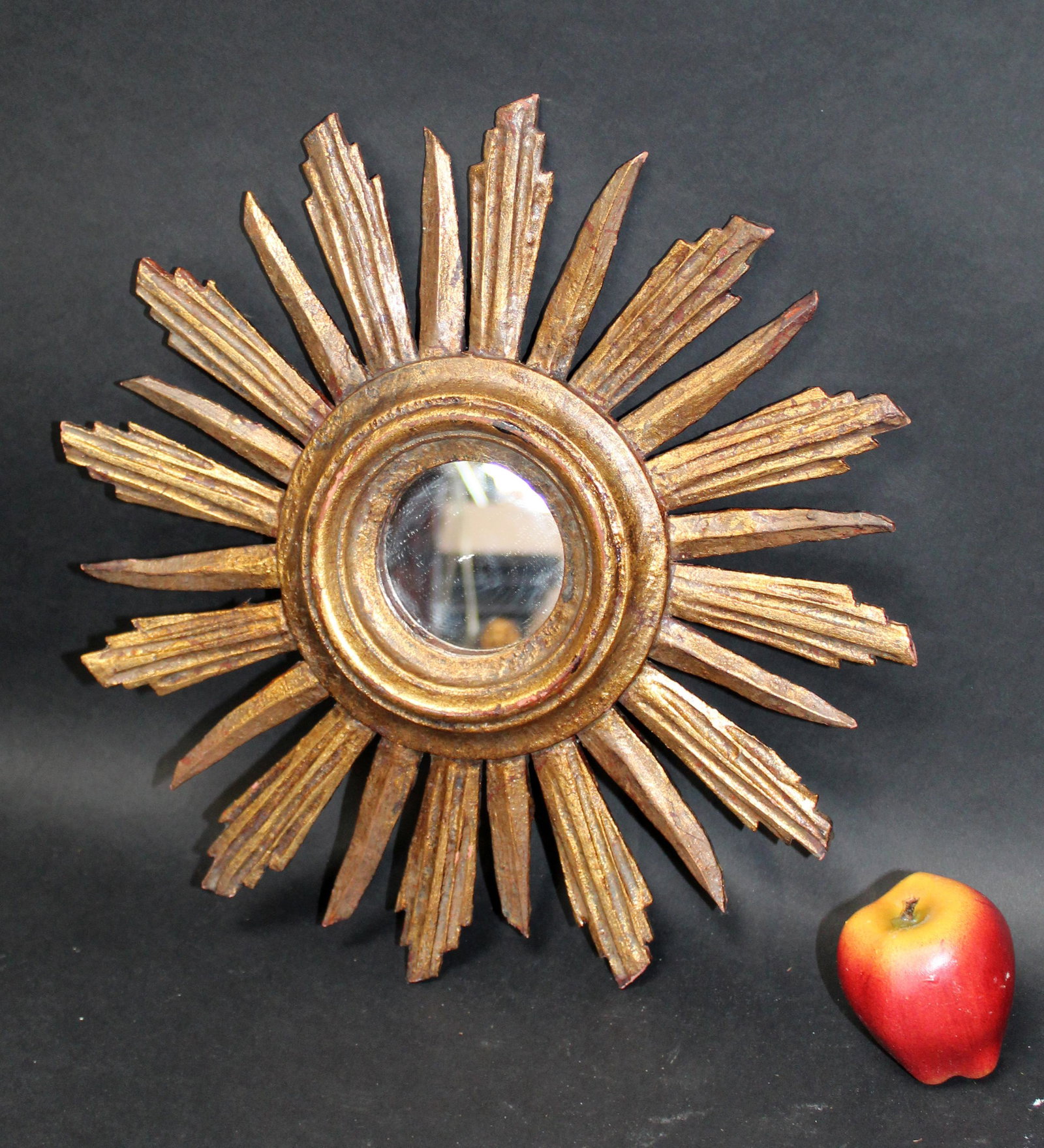 French giltwood sunburst mirror: French giltwood sunburst mirror. Mid 20th century. 15" dia