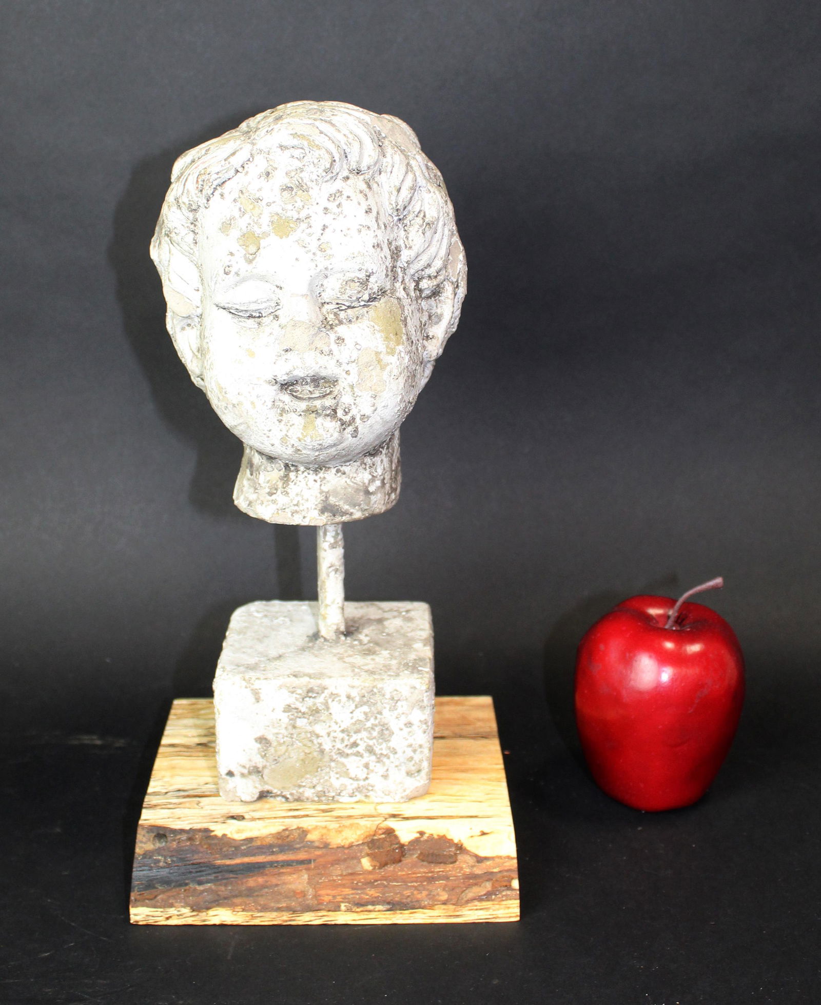 Cast cherub form bust on wooden base (1 of 7)