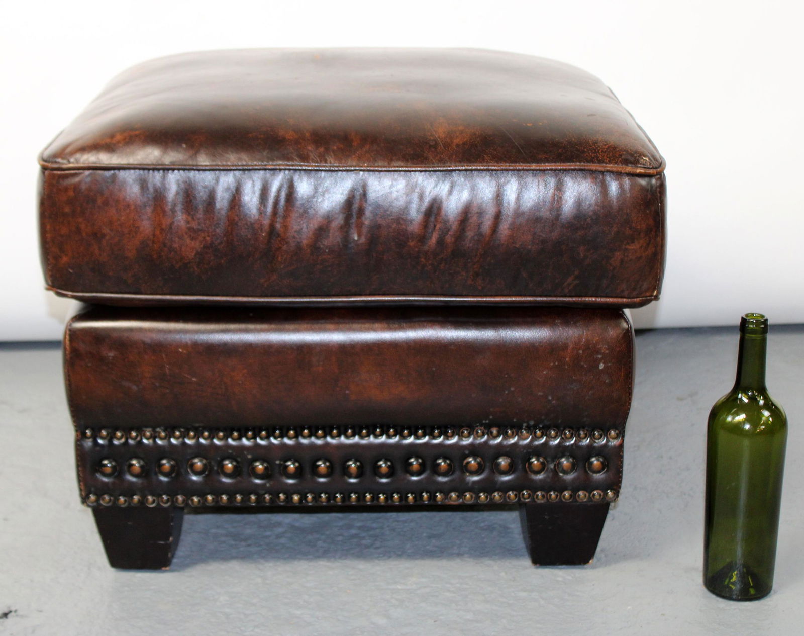 Leather ottoman with nailhead trim (1 of 5)