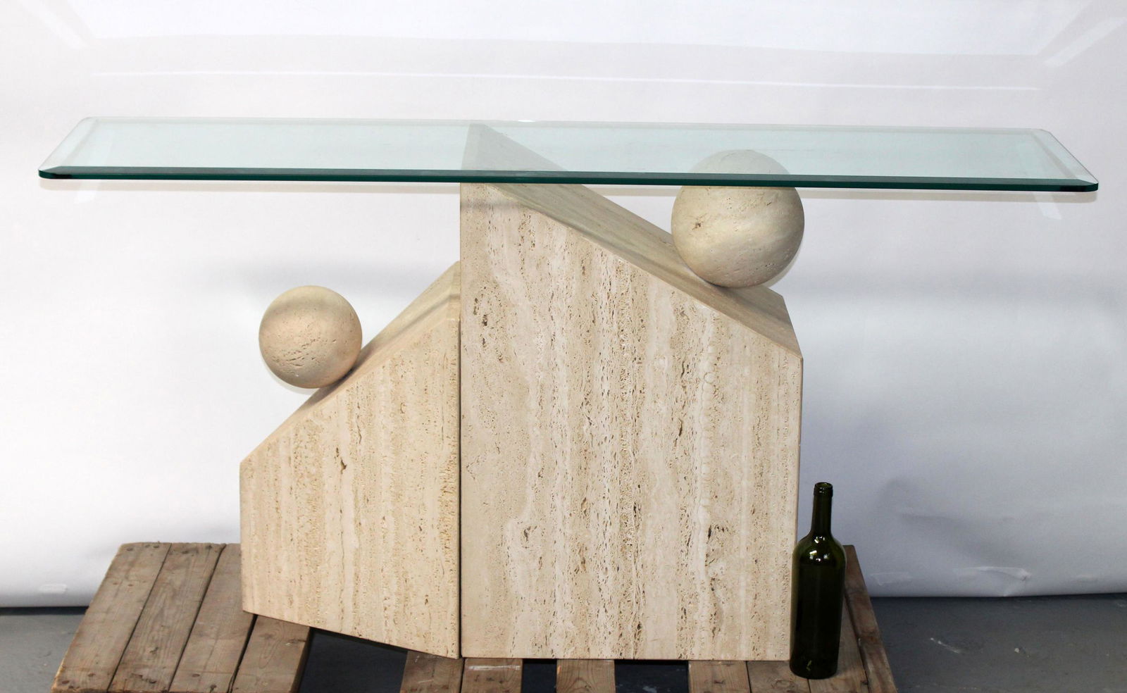 Italian travertine double pedestal console: Italian travertine double pedestal console with beveled glass top. Late 20th century. 30 1/4"h x 60"w x 16"d