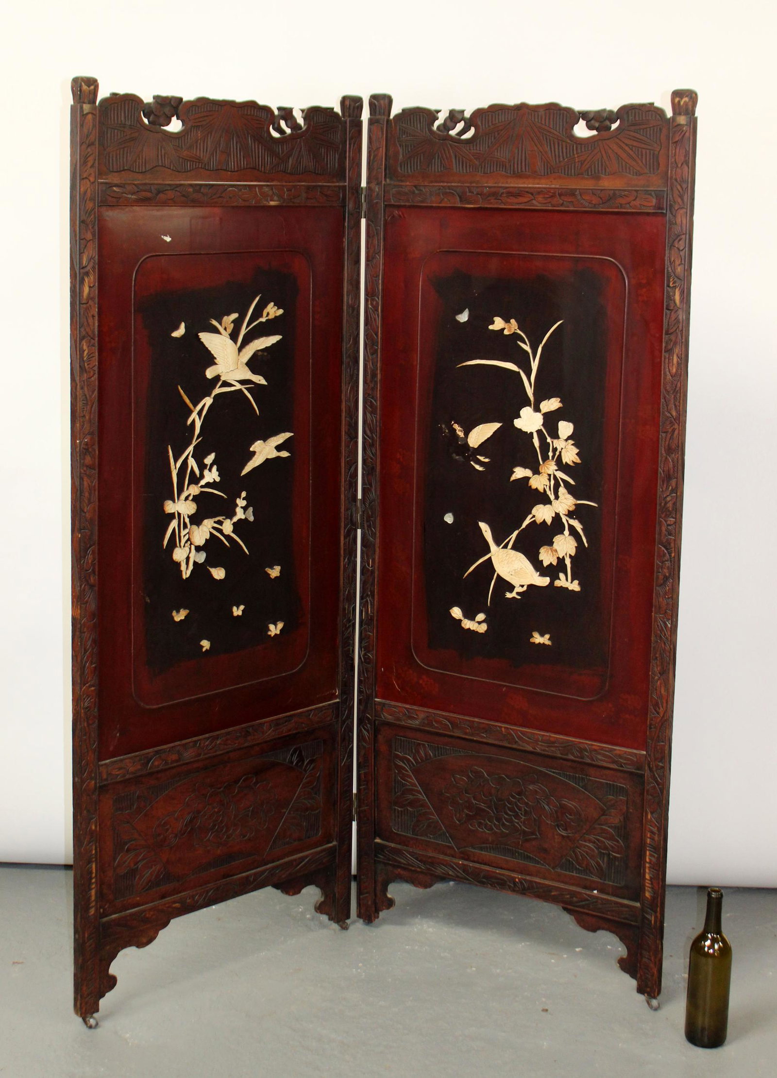 Chinese 2 panel folding screen: Chinese 2 panel folding screen with applied bone carvings. 20th century. Each panel measures 66 1/2"h x 26"w.