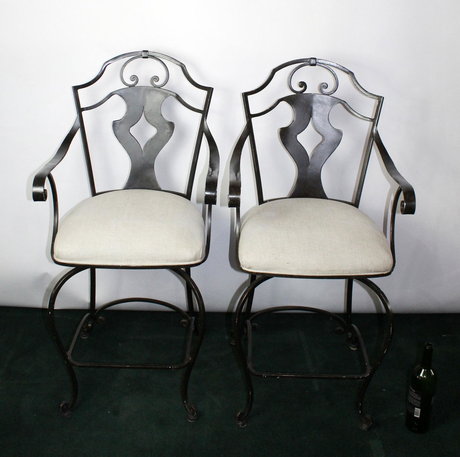 Pair of swivel counter height iron stools (1 of 6)