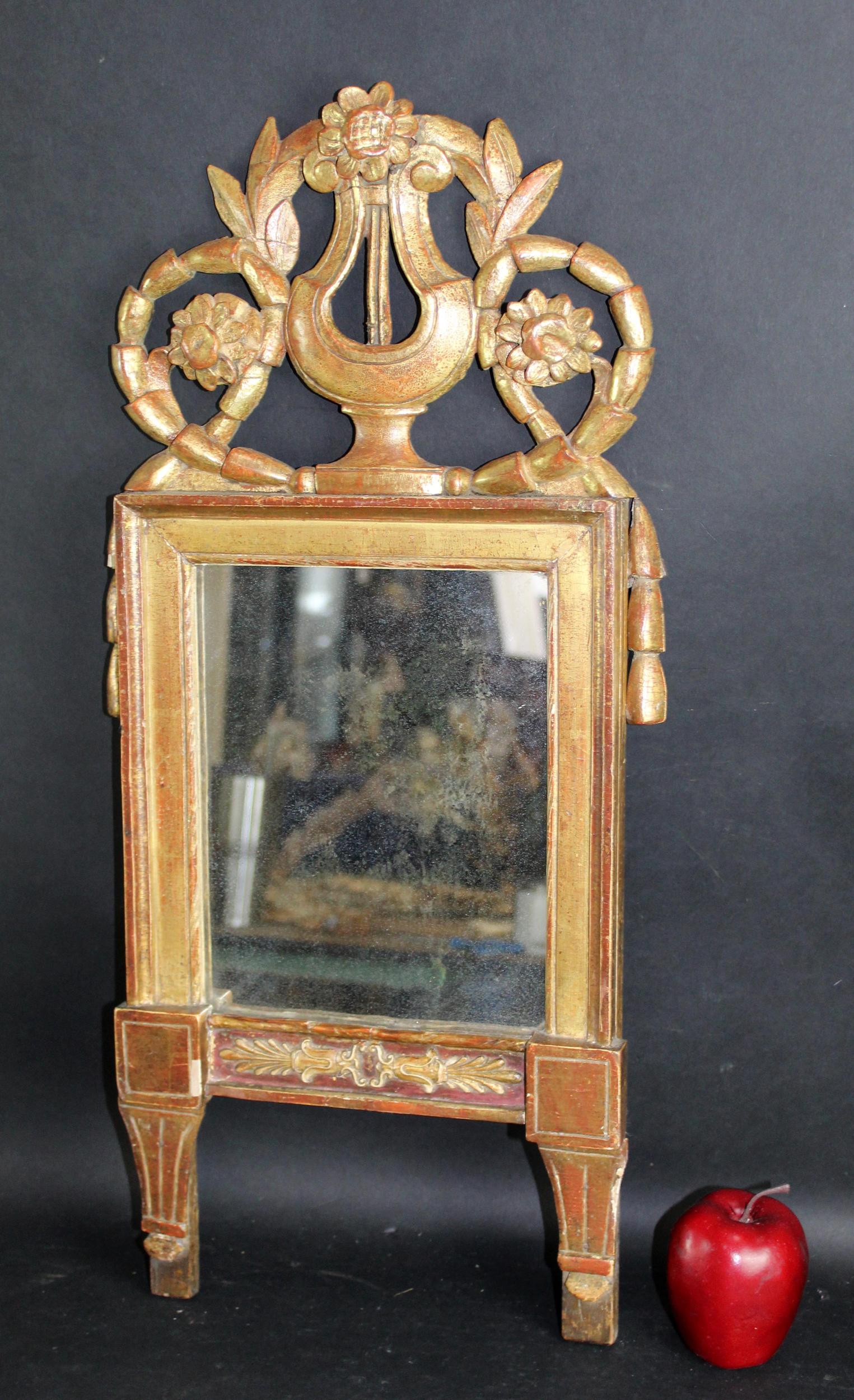 French Louis XVI gilt wood mirror with harp: French Louis XVI gilt wood mirror with harp. Early 19th century. 29"h x 12"w