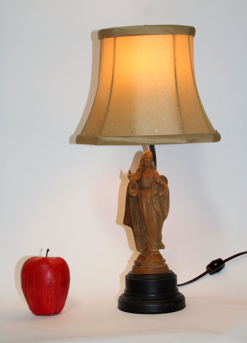 Carved wooden statue of Jesus mounted as lamp: Carved wooden statue of Jesus mounted as lamp. Figure early 20th century. Late mounted as lamp. 19"h x 11"w