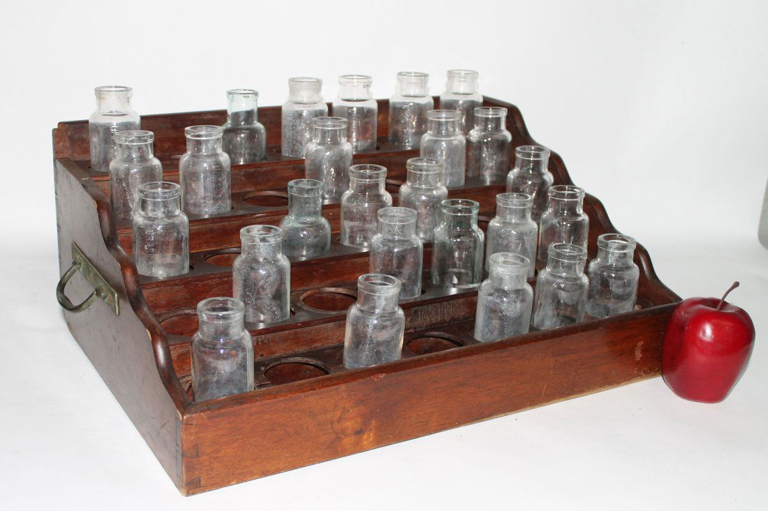 French apothecary bottles in display rack (1 of 10)