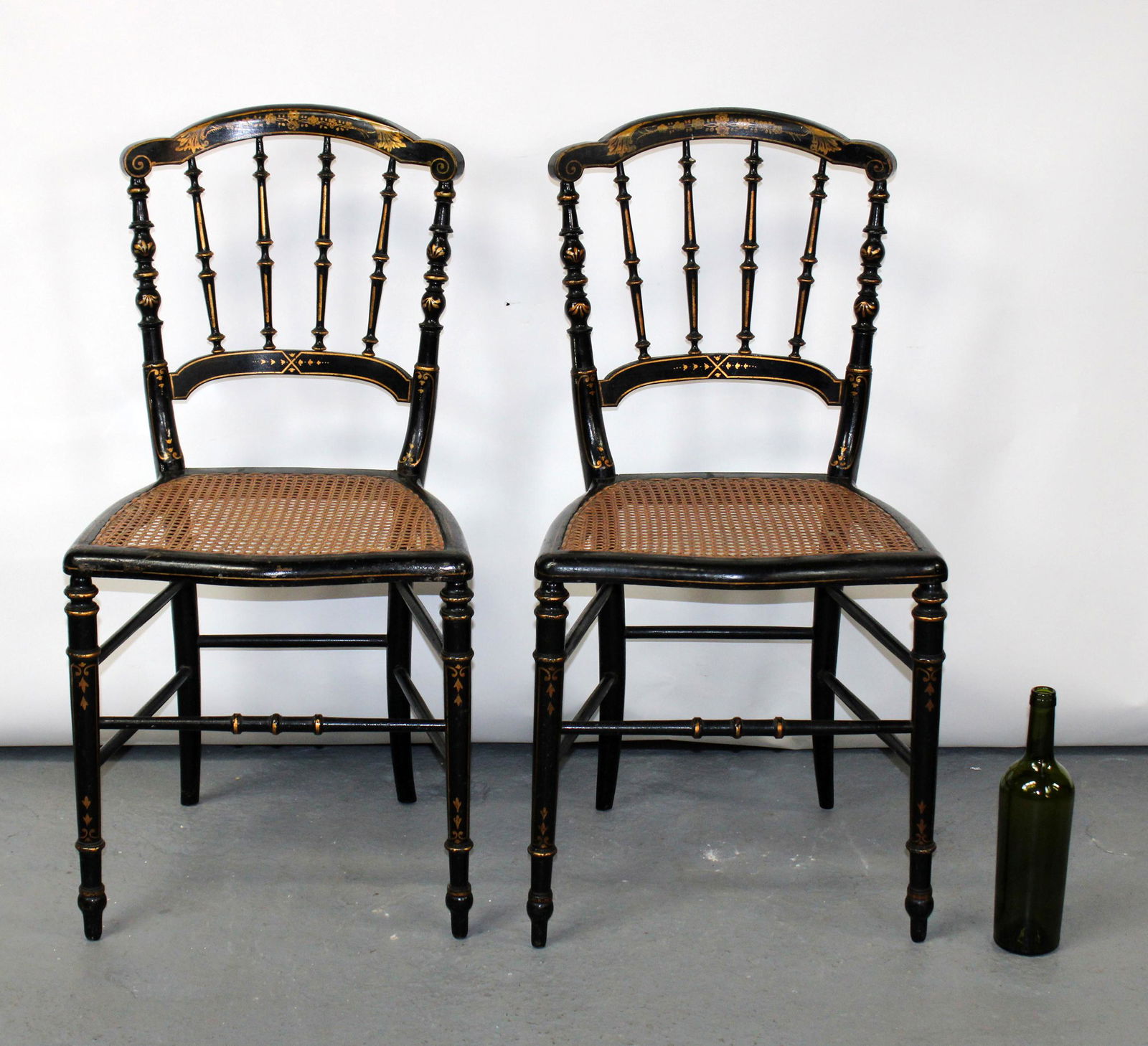 Pair of French ebonized side chairs with caned seats (1 of 9)