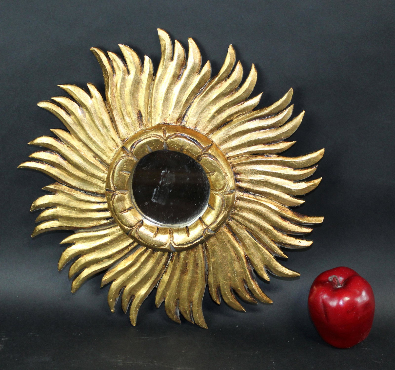 French giltwood sunburst mirror: French giltwood sunburst mirror. Mid 20th century. 14 1/2" dia