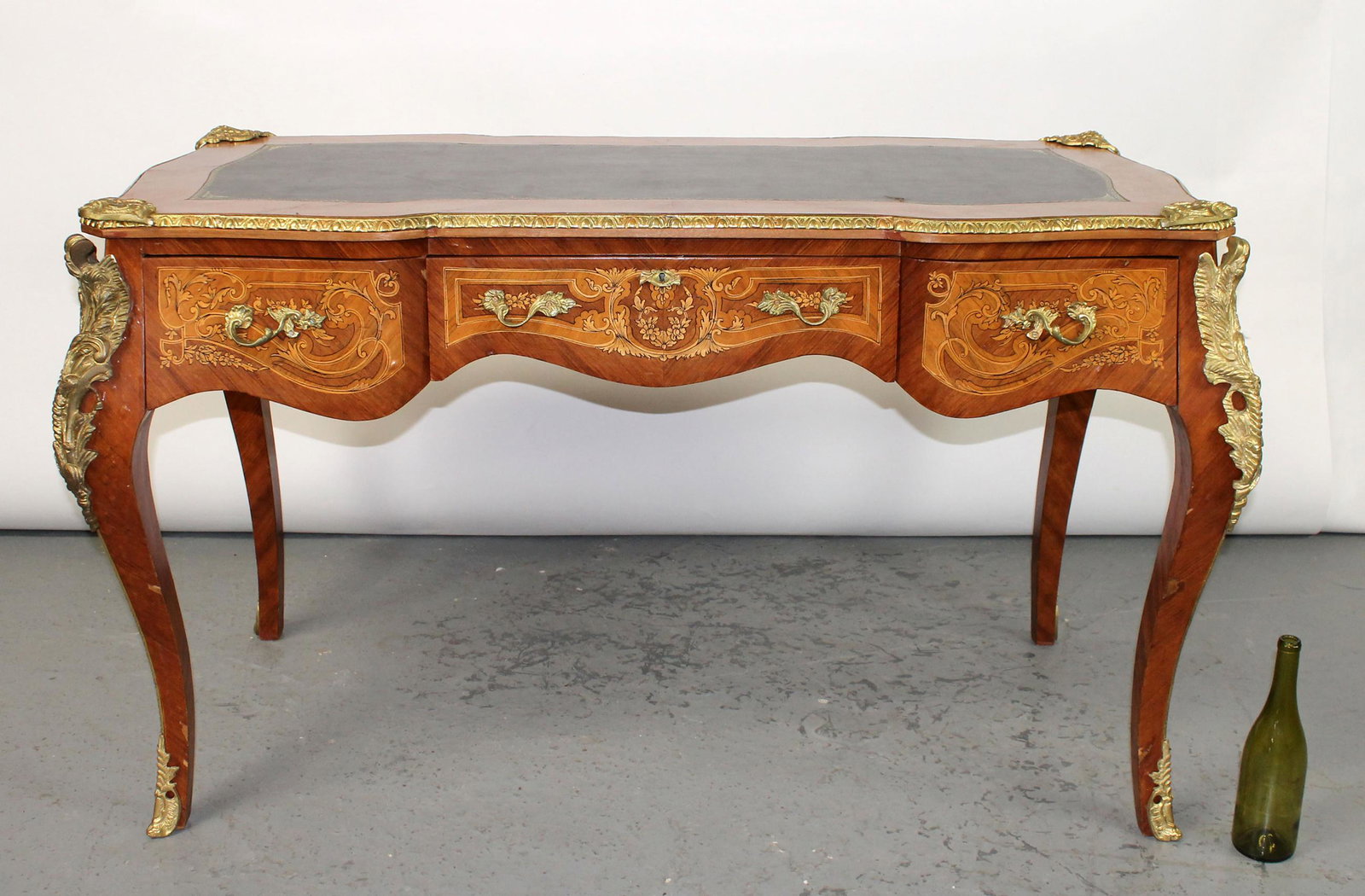 Louis XV style leather top bureau plat desk: Louis XV style leather top bureau plat desk with bronze figural decoration. Painted floral decoration. Late 20th century. 32"h x 59"w x 29 1/2"d