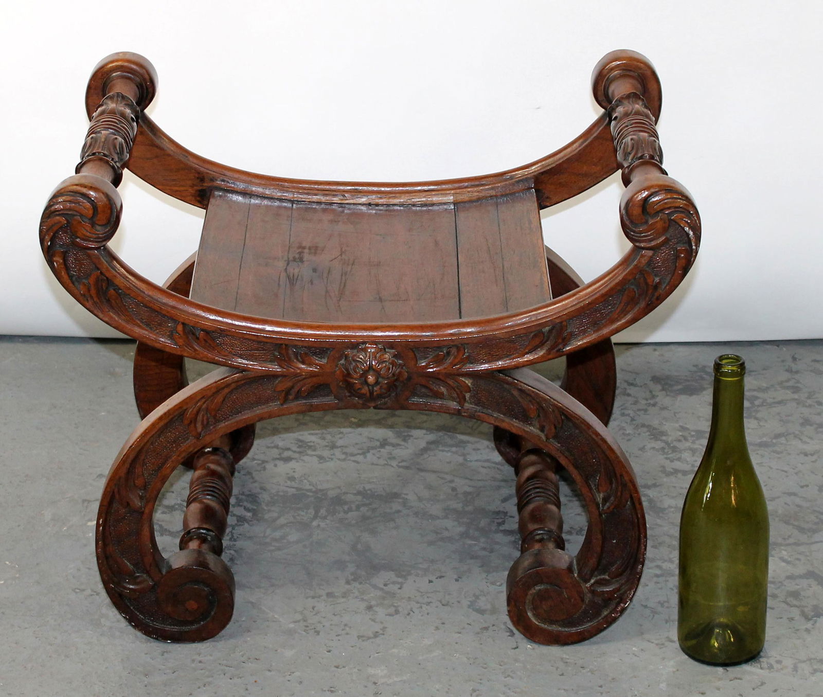 Carved curule curved stool with arms (1 of 7)