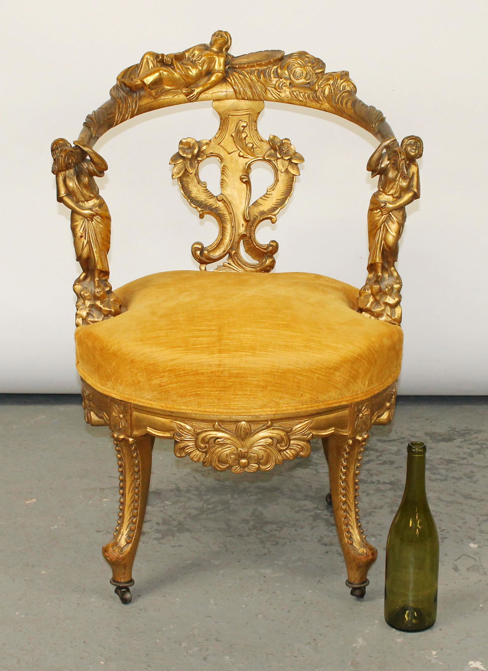 Italian Renaissance Revival gilt armchair: Italian Renaissance Revival gilt armchair with figural supports. 32"h x 22 1/2" x 23"d