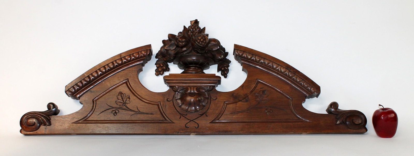 French carved walnut overdoor crest with fruited urn: French carved walnut overdoor crest with fruited urn focal. early 20th century. 15 1/2"h x 44 1/2"w