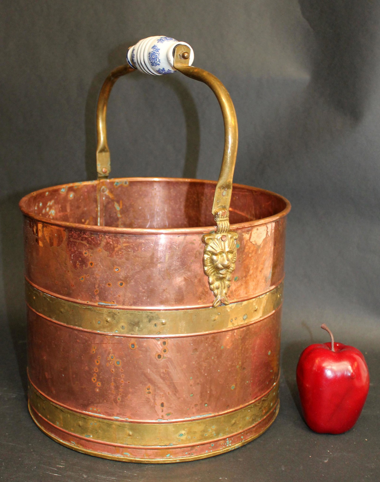 Copper and brass bucket with porcelain handle: Copper and brass bucket with porcelain handle. Mid 20th century. 16 1/2"h x 12"w