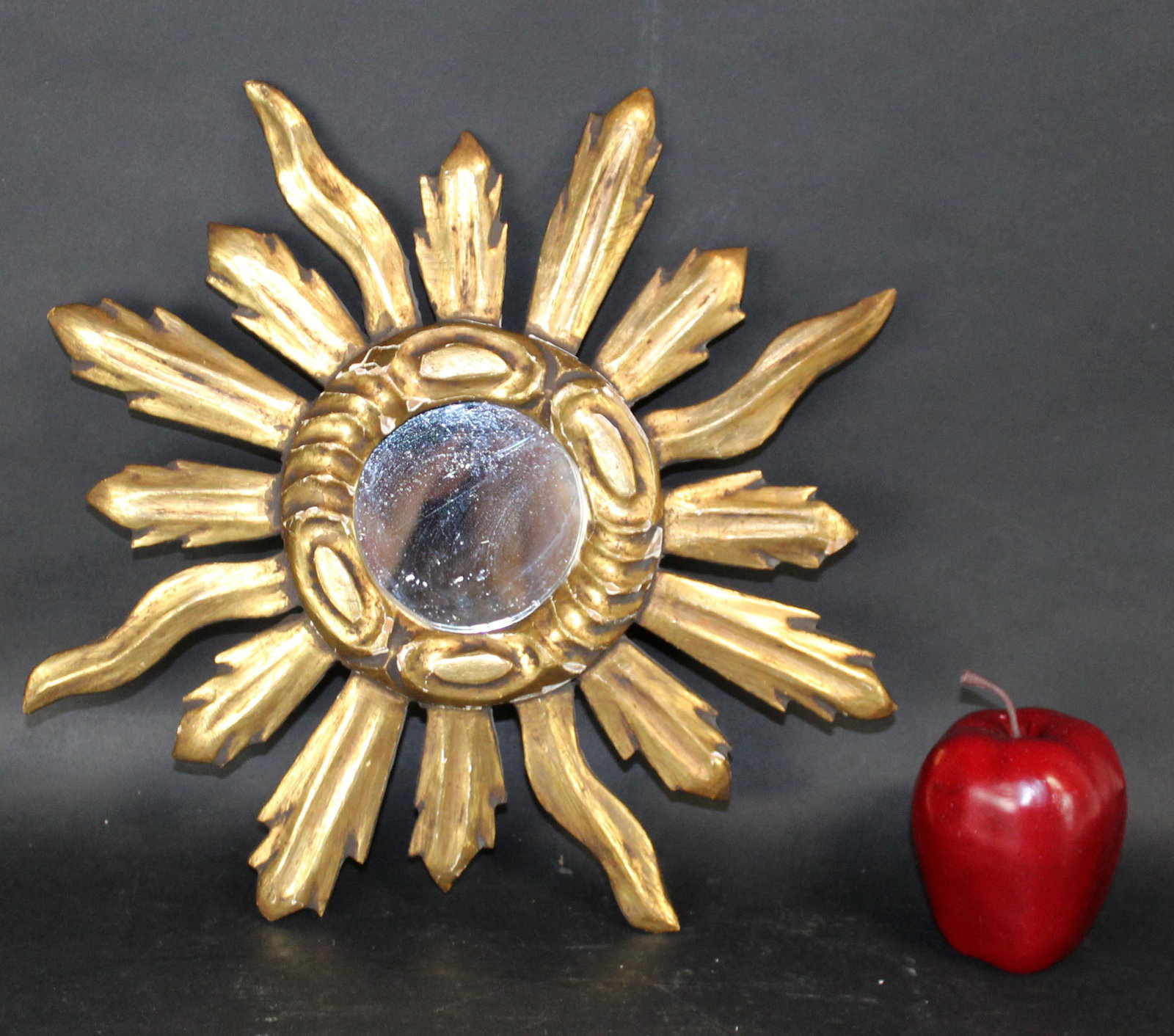French sunburst mirror in gilt wood: French sunburst mirror in gilt wood. Circa 1970's 12 3/4"diam