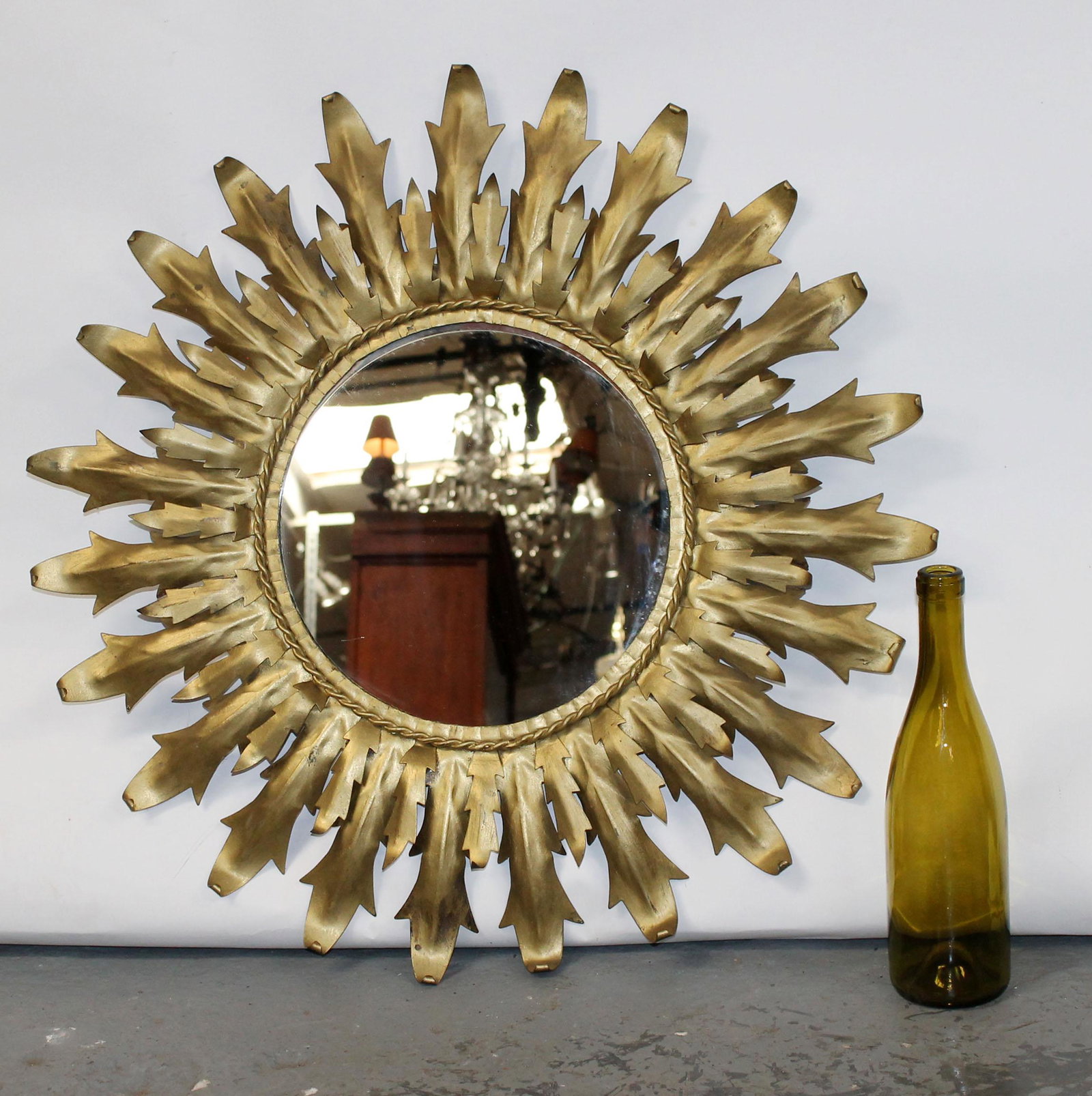 French sunburst mirror in gilt metal: French sunburst mirror in gilt metal. Circa 1990's. 25 5/8"dia