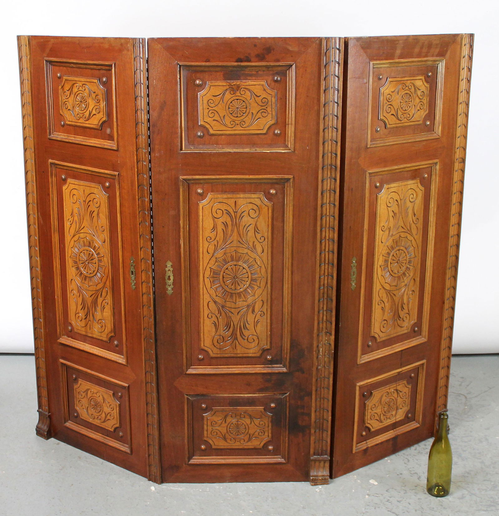 Antique carved doors mounted as 3 panel folding screen (1 of 11)