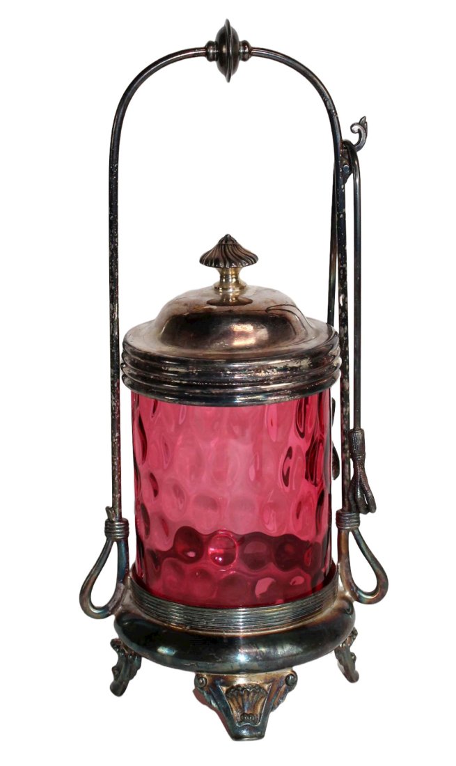 Meridien silver Co Victorian pickle castor: Victorian cranberry thumbprint glass pickle castor in Meridien Co silverplate plate holder with tongs. 12"h x 5 1/2"