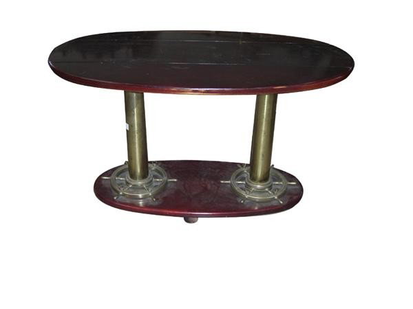 Nautical cocktail table with bronze ships wheel bas: 42.5"l