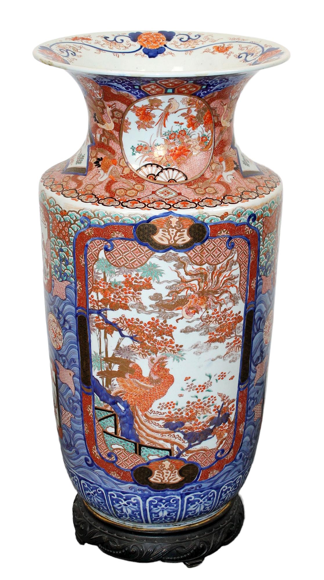 Japanese Imari porcelain urn on stand: Japanese Imari porcelain urn on stand. 33"h x 15 1/2" dia at the top. 20th century.