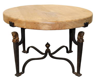 French Jean-Charles Moreux style iron base cocktail table: French Jean-Charles Moreux style mid century iron base cocktail table. Natural finish oak round top on wrought iron base with horse head capitals. Mid 20th century. 19 1/2"h x 30 1/2" dia