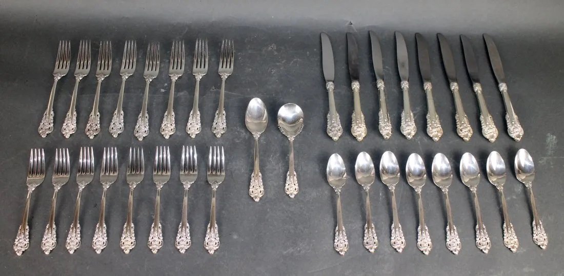 34pieces Wallace Grand Baroque sterling flatware: 34 pieces Wallace Grande Baroque Sterling Silver flatware. 8 knives 9", 8 dinner forks 7 1/2"l, 8 luncheon forks 6 1/2"l, 8 teaspoons 6"land 2 small serving spoons 6" and 7" l.