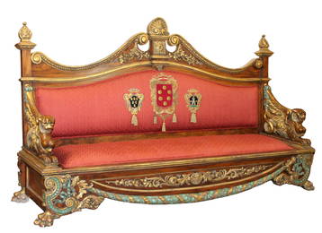 Exceptional Italian carved walnut sofa with griffins, relief carved garland, paw feet and gilt