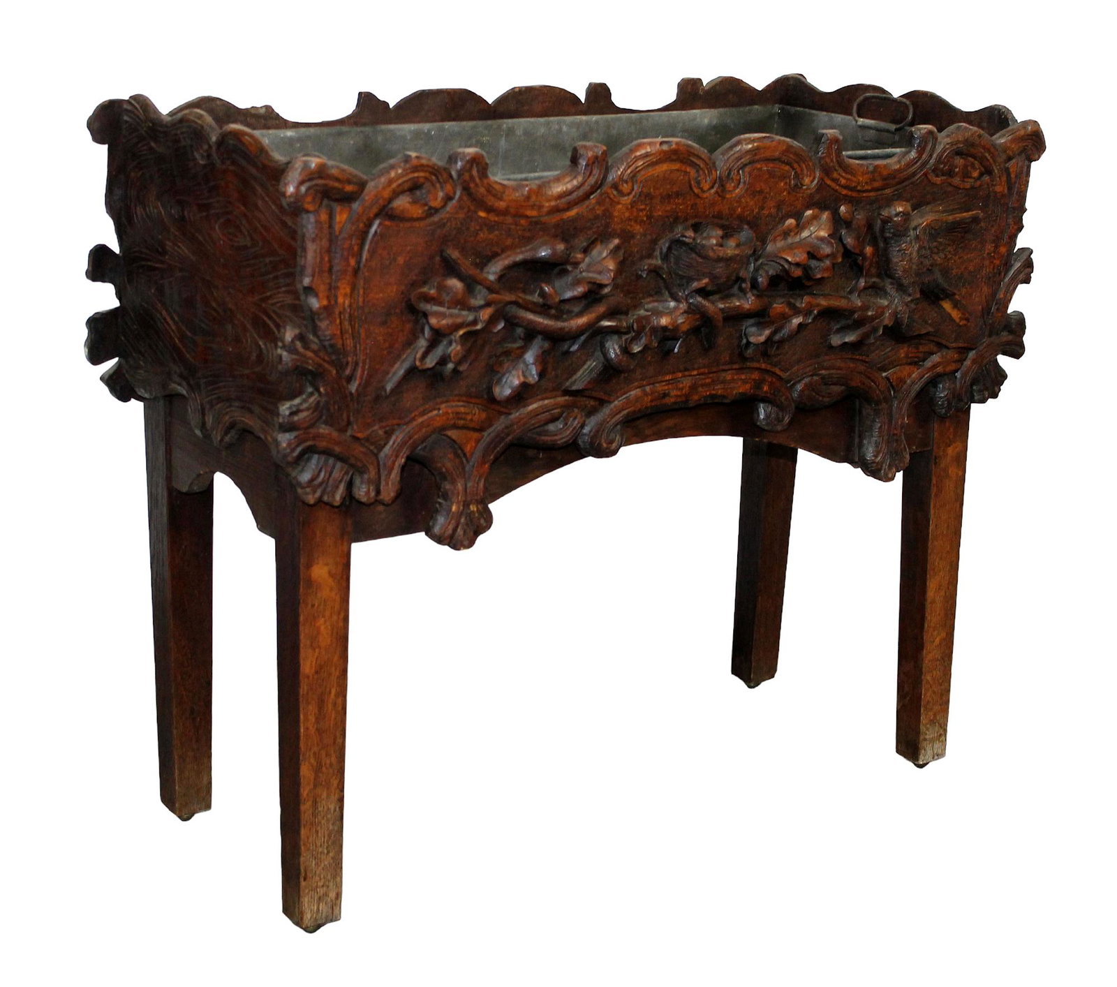 French Black Forest jardiniere on legs: French Black Forest jardiniere on legs in carved oak. Carvings of nest with eggs flanked by bird on 1 side and a snake on the other. Late 19th century. 25 1/2"h x 31 1/4"w x 13 1/2"d