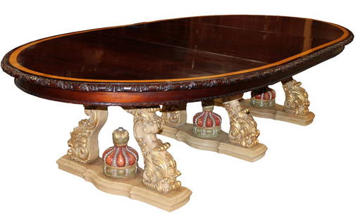 Italian Baroque oval banded mahogany dining table on carved triple pedestal base: Italian Baroque oval banded mahogany dining table on triple polychrome carved bases with crowns. 3 section base with 2 finished 24"wide leaves. Overall 30 1/2"h 167"l x 60"w (119" length without the l