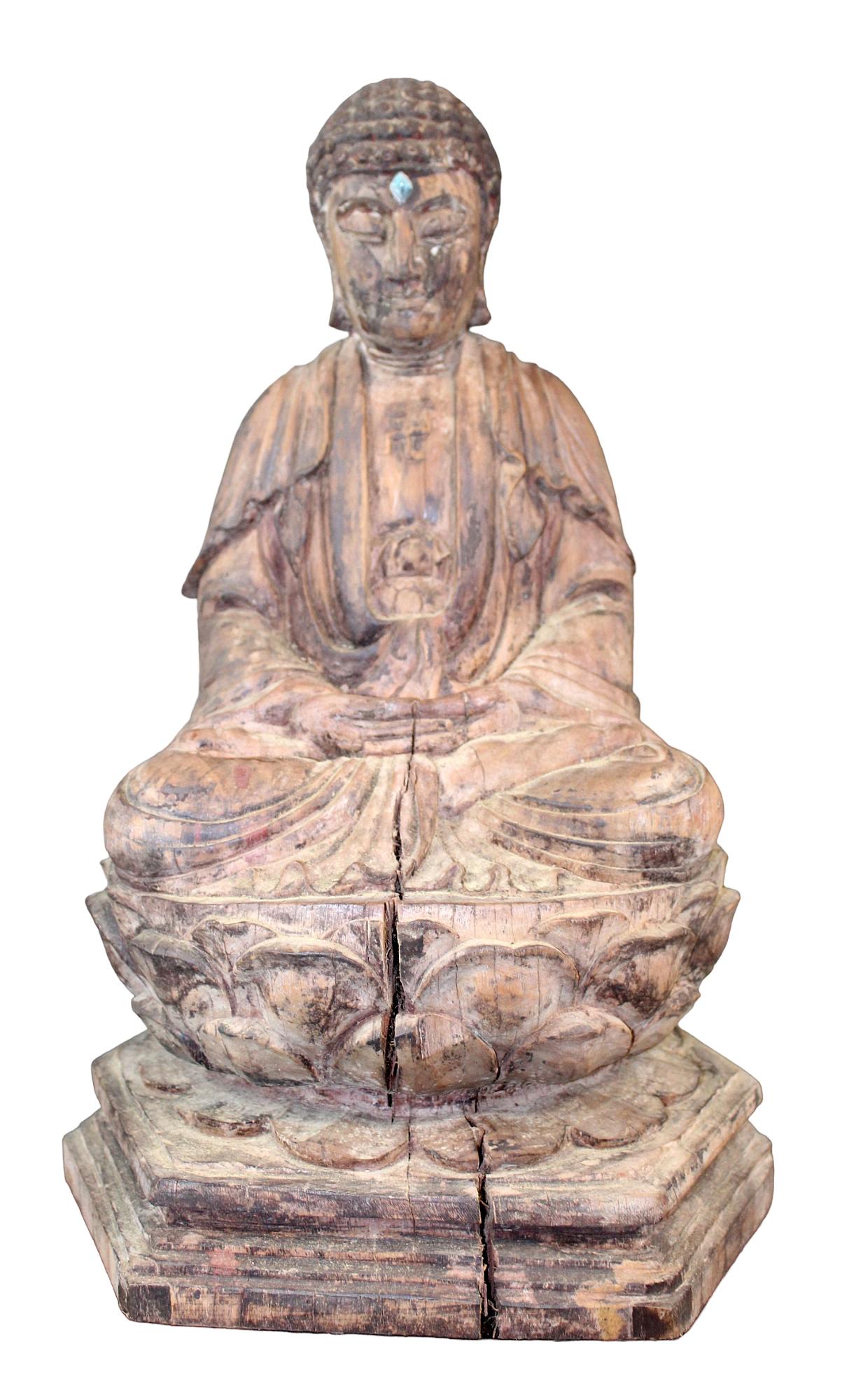 Tibetan carved wooden seated Buddha: Tibetan carved wooden seated Buddha in lotus 18" h x 11 1/2" w x 10" d