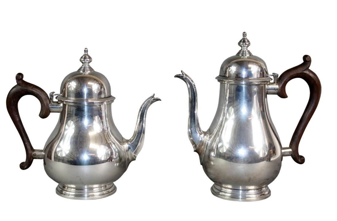 Fisher sterling silver George III tea & coffee pots: Fisher sterling silver George III tea & coffee pots. Coffee pot: 9 1/2" h x 8 1/2" w x 4 3/4" diam Tea pot: 8 1/2" h x 8 3/4" w x 5 1/4" diam