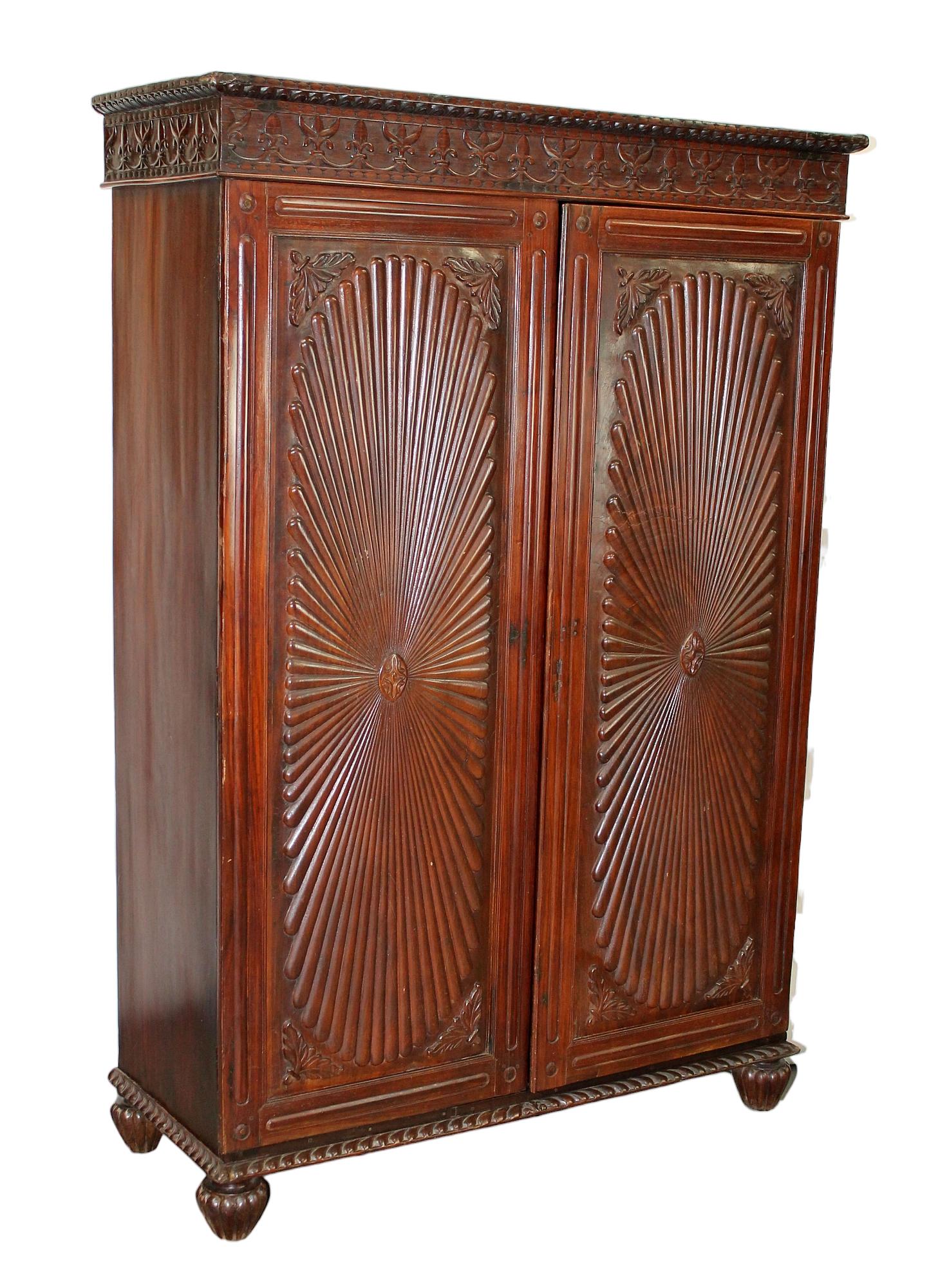 Antique Anglo Indian Indo Portuguese 2 door cabinet: Antique Anglo Indian Indo Portuguese 2 door cabinet with relief carved sunburst design. Late 19th century/Early 20th century. 73"h x 43"w x 20"d