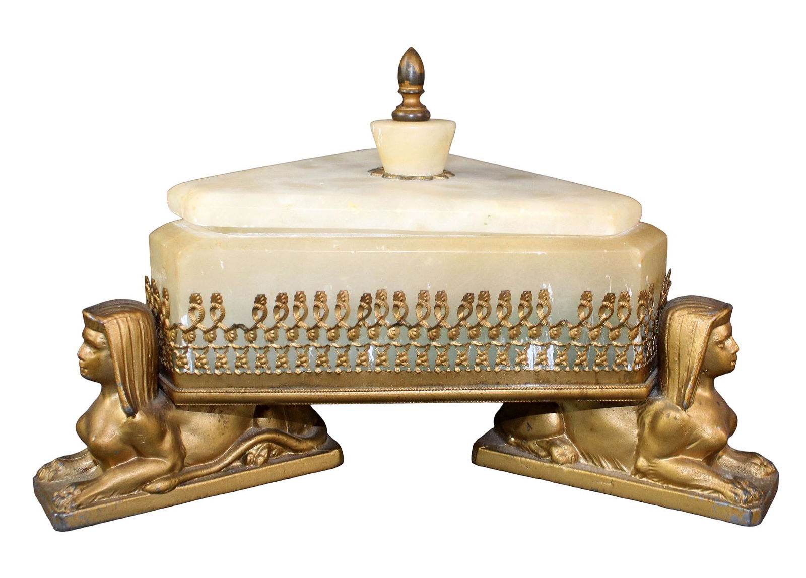 Egyptian Revival alabaster triangle box on sphinx base: Egyptian Revival alabaster triangle box on sphinx base. Early 20th century. 6 1/2" h x 10 1/2" w x 9 1/2" d