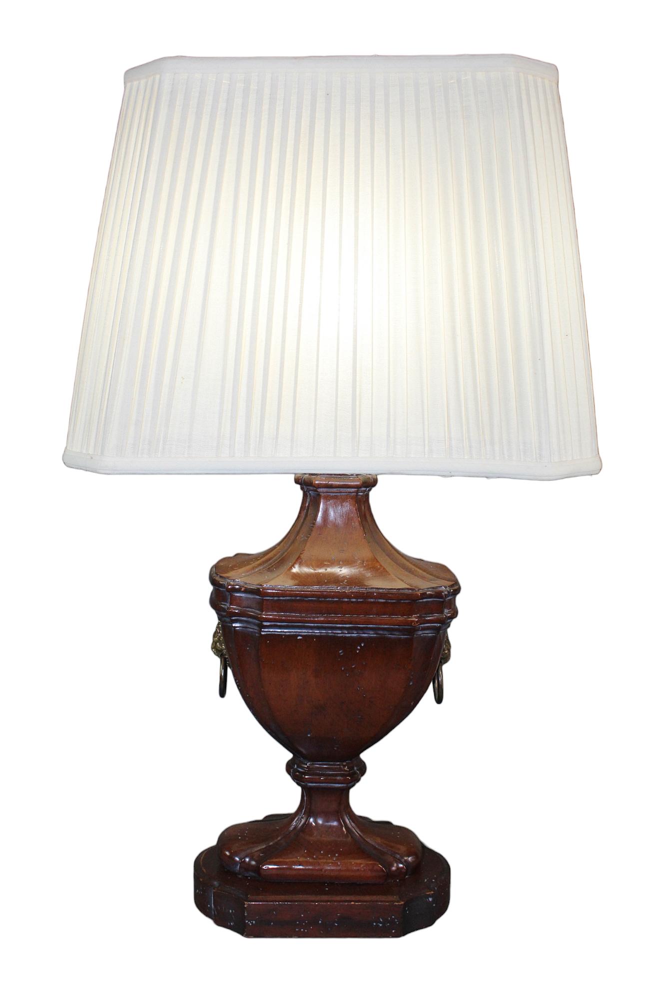 Frederick Cooper classical urn form table lamp: Vintage Frederick Cooper (shade marked) carved wooden classical urn form table lamp with brass lion head rings. 31" h x 9 1/2" w x 6" d