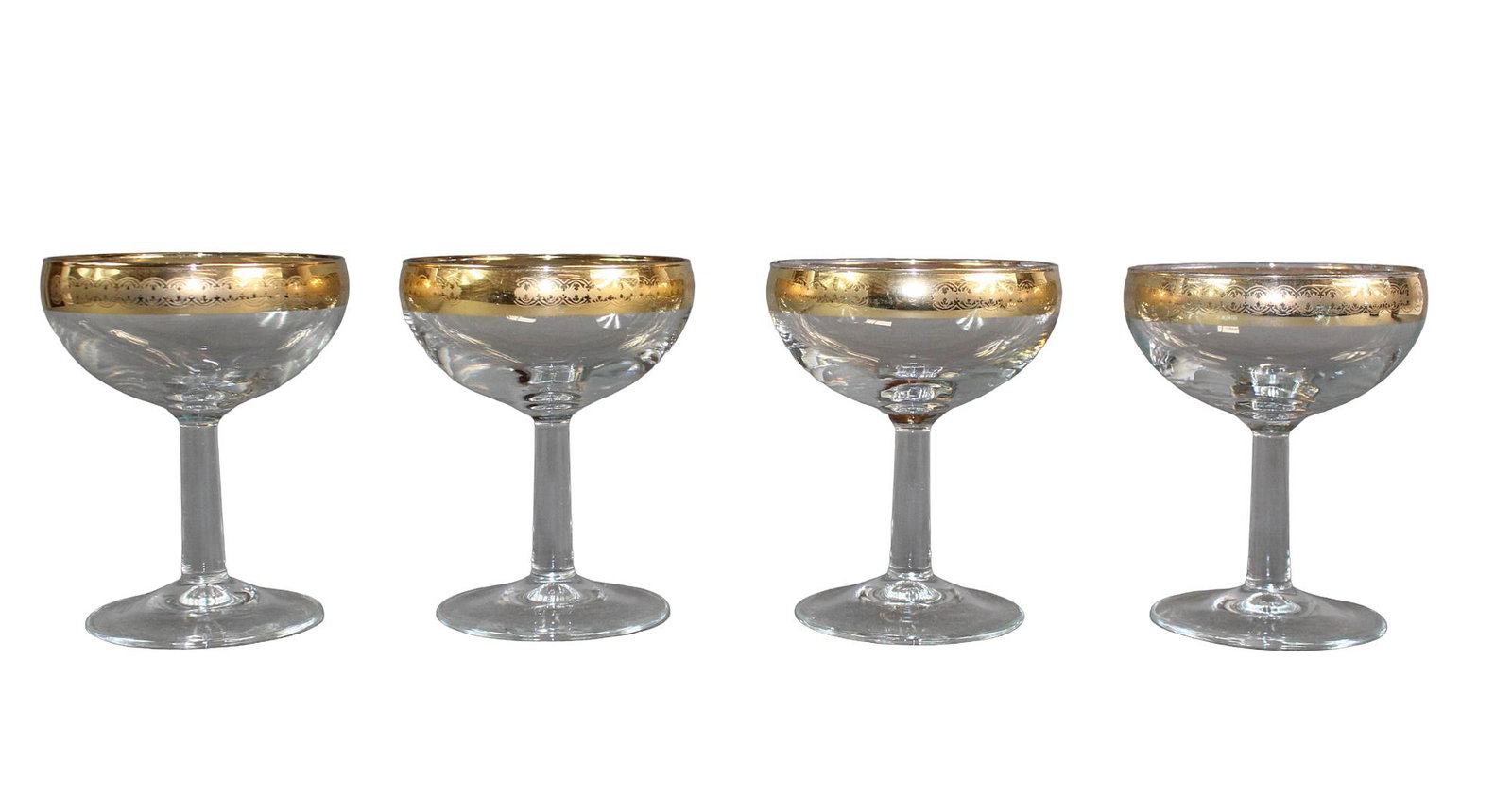 Set of 4 mid-century champagne coupes: Set of 4 mid-century gold rimmed champagne coupes 4 3/8" h x 3 1/2" diam