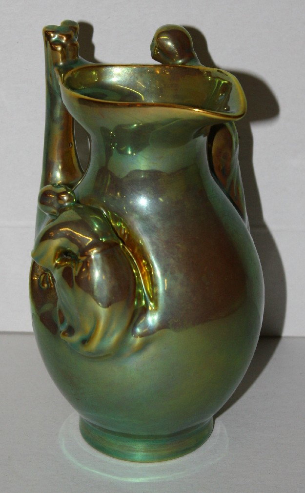 Signed Zsolnay green eosin figural pitcher: 6 1/4"h