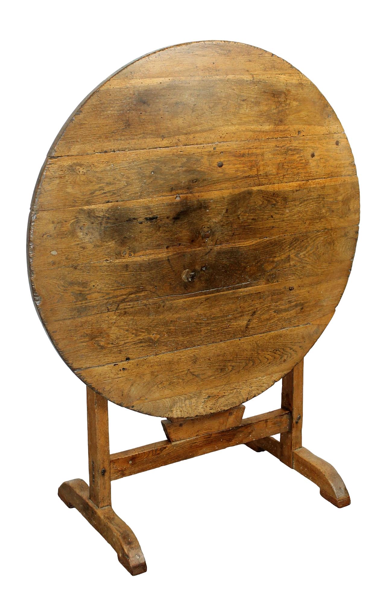 French Provincial oak vintner's wine tasting table: French Provincial oak vintner's wine tasting table. Early 20th century. 25" table height, 39 1/4 flipped up x 30 1/2" dia