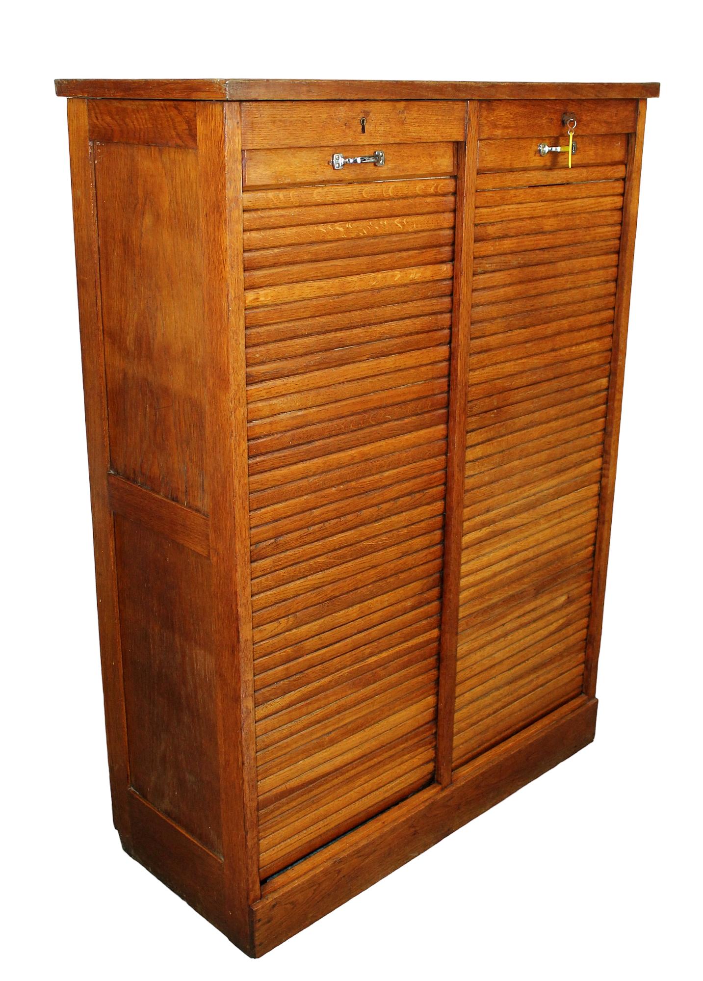 French notary cabinet in oak with tambor doors: French notary cabinet in oak with tambor doors. Mid 20th century. 47"h x 33 1/2"w x 15 1/2"d