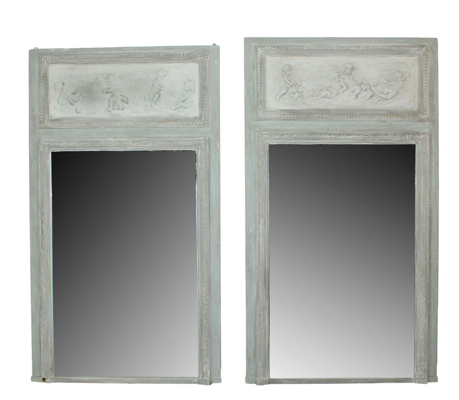 Companion pair of French Parisian trumeau mirrors with raised cherub plaques: Companion pair of French Parisian trumeau mirrors with raised cherub plaques. 19th century. 75 1/4"h x 43"w