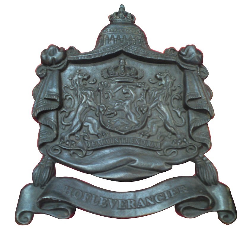 Dutch Royal coat of arms in iron: Marked with inscription "Hofleverancier" which translates to "The purveyor to the Court." This plaque was given to shops to display on the front to show the court had acquired goods from the establish