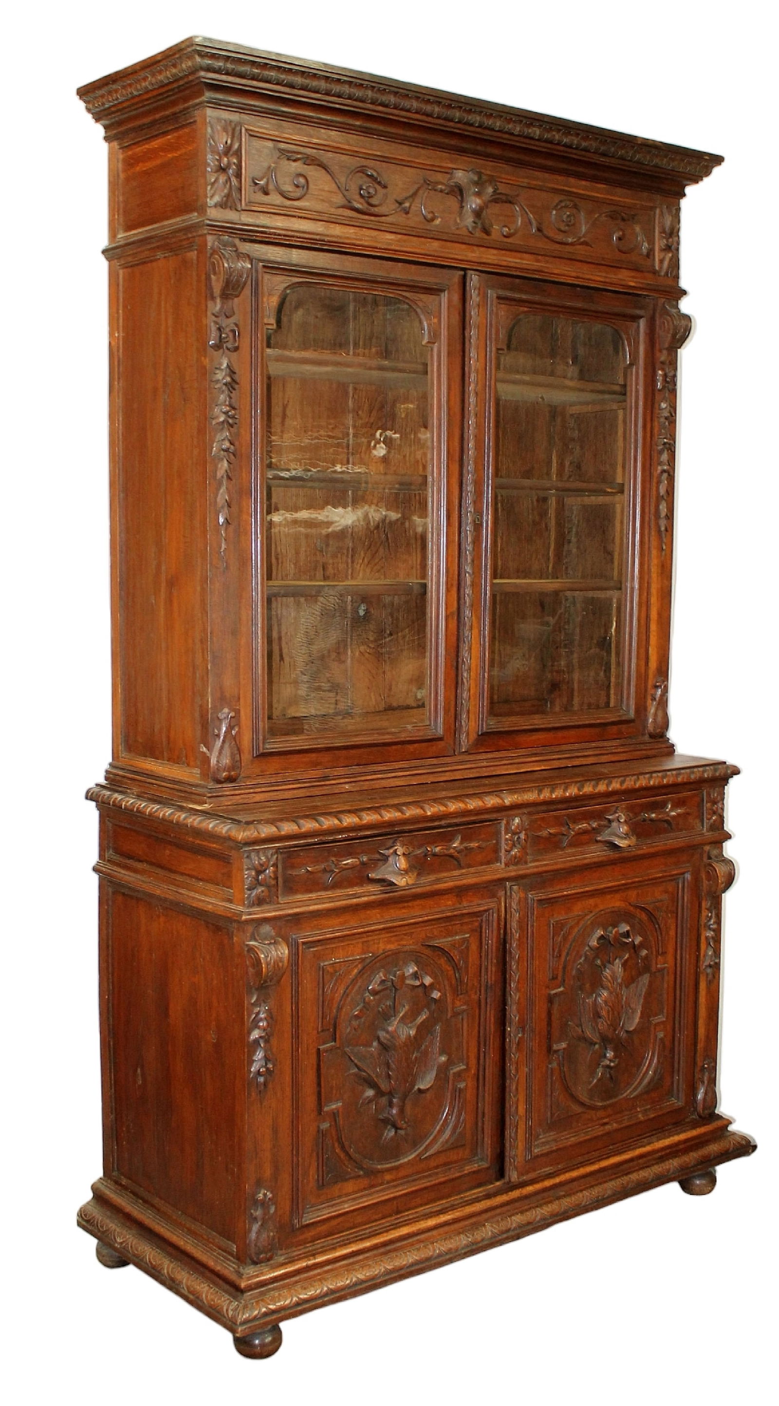 French carved oak bookcase with upper glass doors and lower doors relief carved with game (1 of 9)