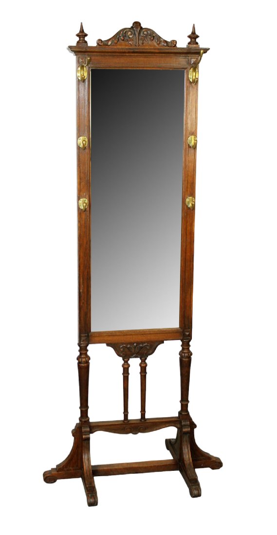 English carved oak standing mirror with hat hooks: English carved oak standing mirror with hat hooks. Early 20th century. 71"h x 30"w x 21"d