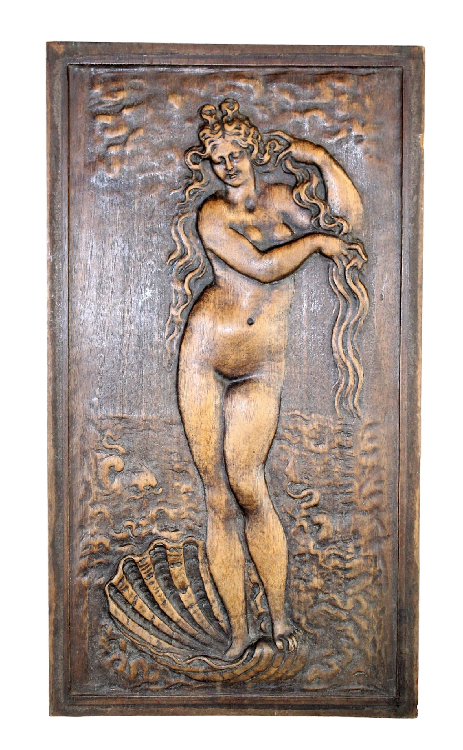 French relief carved walnut panel of Venus: French relief carved walnut panel of Venus on the half shelf. Early 20th century. 17" h x 9 3/8" w