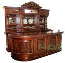 Carved mahogany front and back bar with etched mirrors