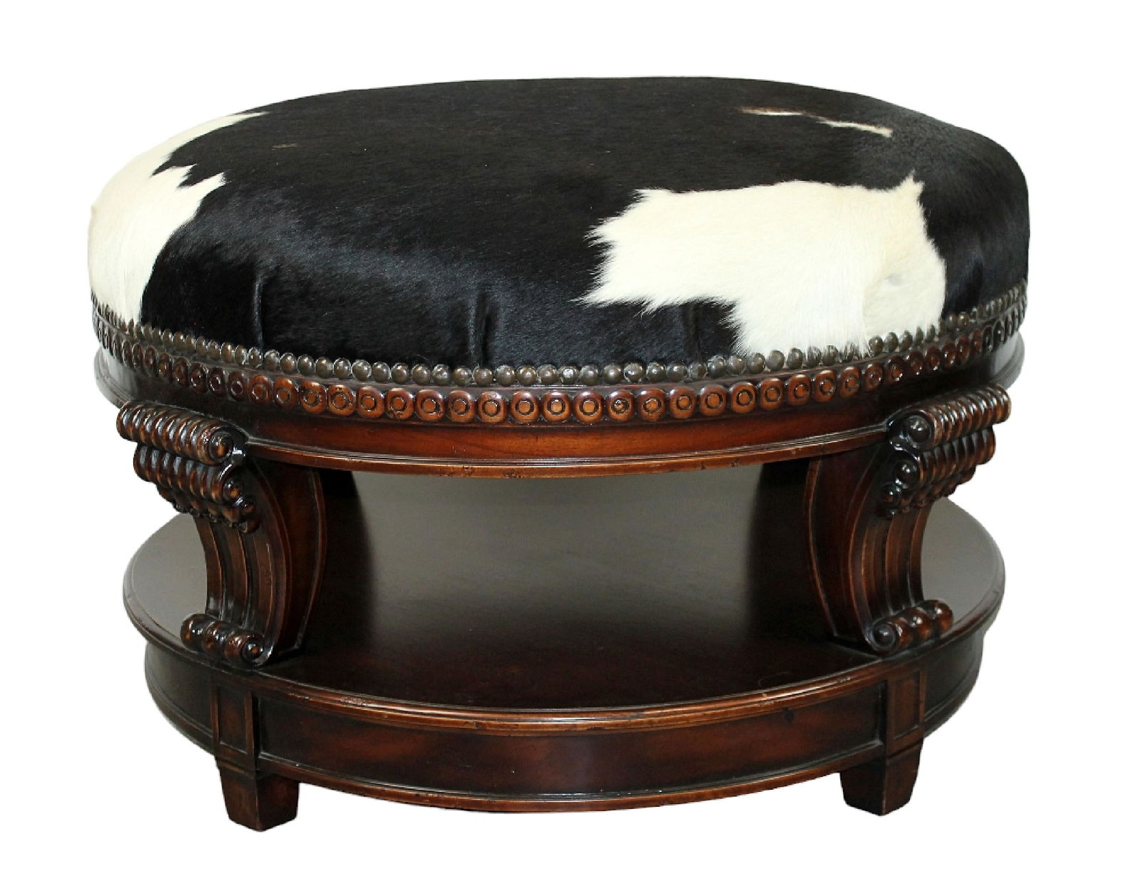 Carved mahogany round ottoman covered in cow hide (1 of 8)