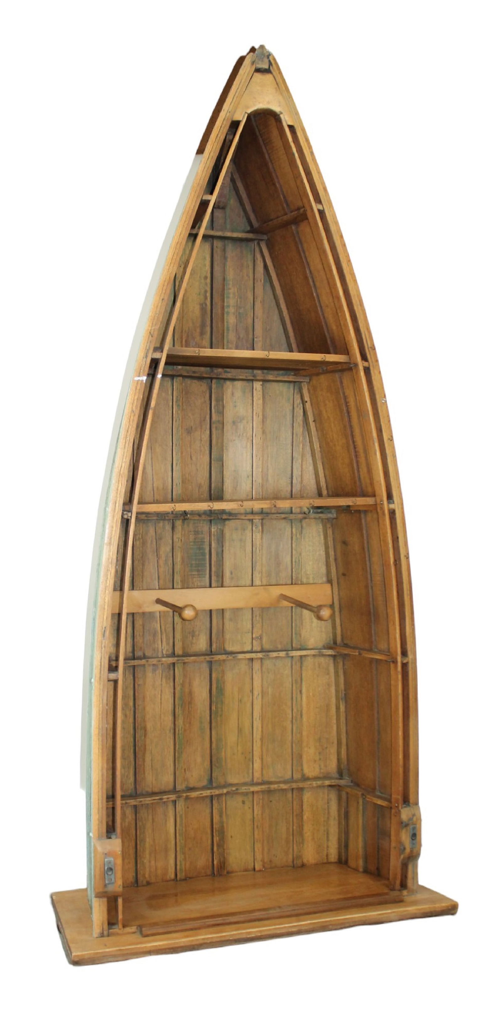 Vintage rowboat mounted as bookshelf with coat hooks: Vintage rowboat mounted as bookshelf with coat hooks. 109 3/4"h x 43"w Base is 50 1/2"w x 23"d