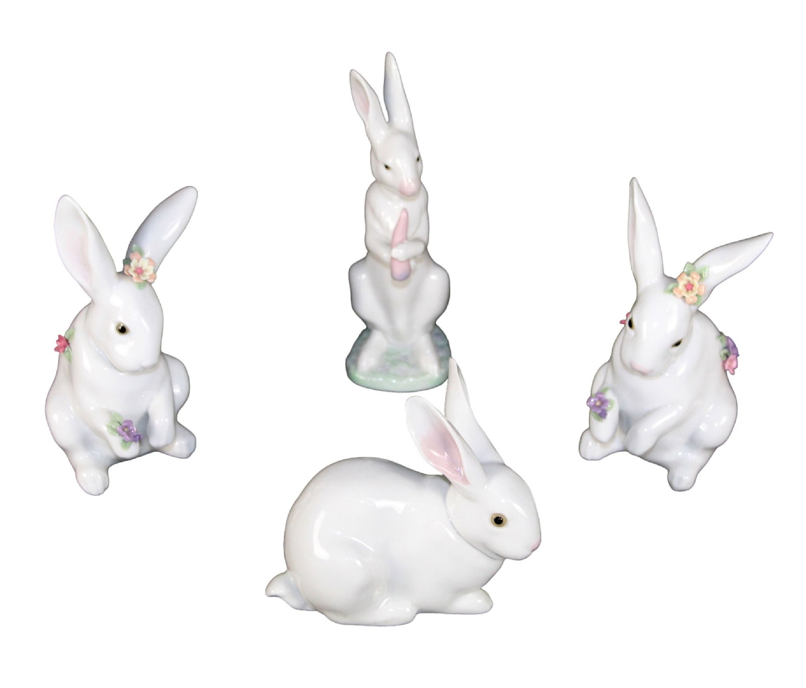 Lot of 4 Lladro bunnies: Lot of 4 Lladro bunnies. Made in Spain. Sizes vary, range approx from 6 1/2"h x 2"w x 3 1/4"d to 4 1/4"h x 2 1/2"w x 4 3/8"d Total weight of figurines only approx: 3lbs