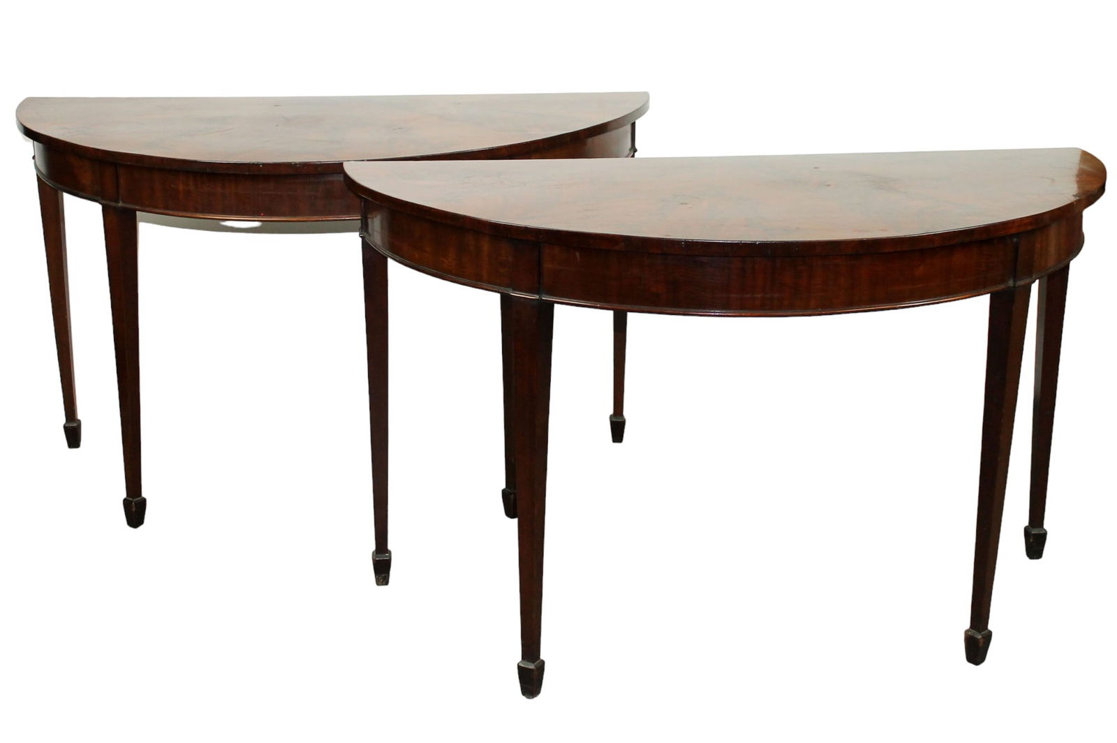 Pair of demi-lune console tables in mahogany with crotch mahogany sunburst tops: Pair of demi-lune console tables in mahogany with crotch mahogany sunburst tops. 19th century. 29 1/2"h x 51 1/4"w x 25 1/4"w As round table 50 1/2"dia