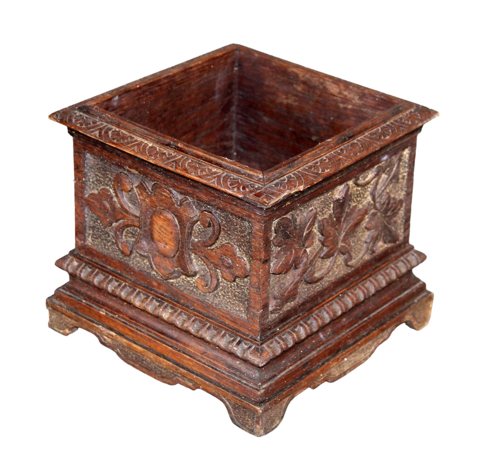 French Black Forest relief carved diminutive cache pot: French Black Forest relief carved diminutive cache pot. Early 20th century. 7 3/4"h x 8 3/4"sq. Weight: 3lbs
